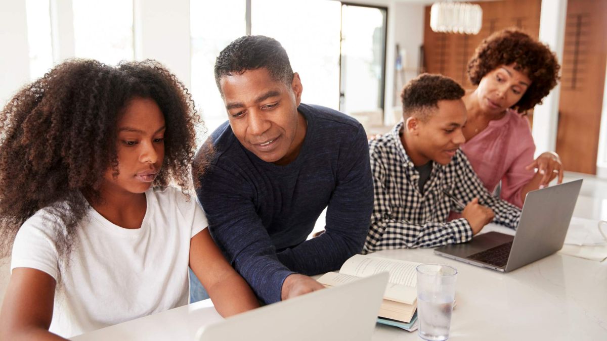 parents helping teens do homework