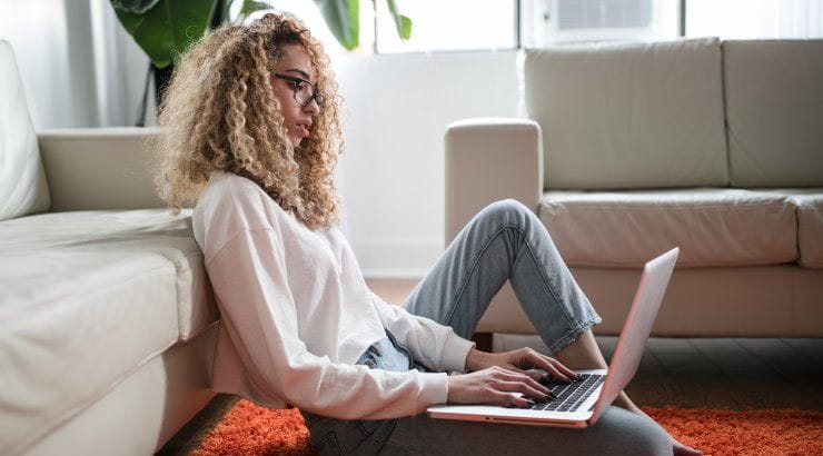 girl typing on laptop