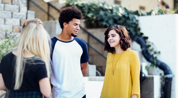 students talking on college campus