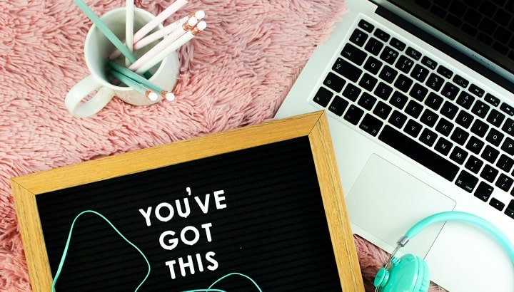 letterboard and laptop on desk