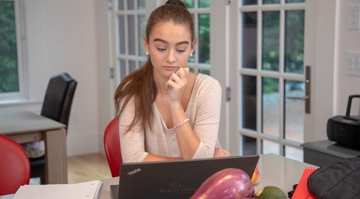 girl looking at laptop