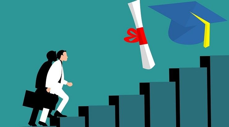 man climbing stairs toward grad cap