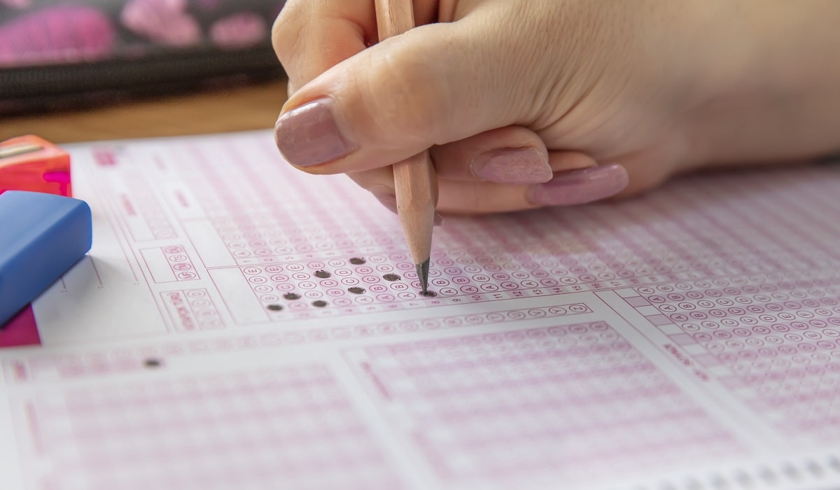 person filling out standardized test