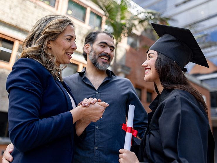 A college graduate looking at her mom and dad.